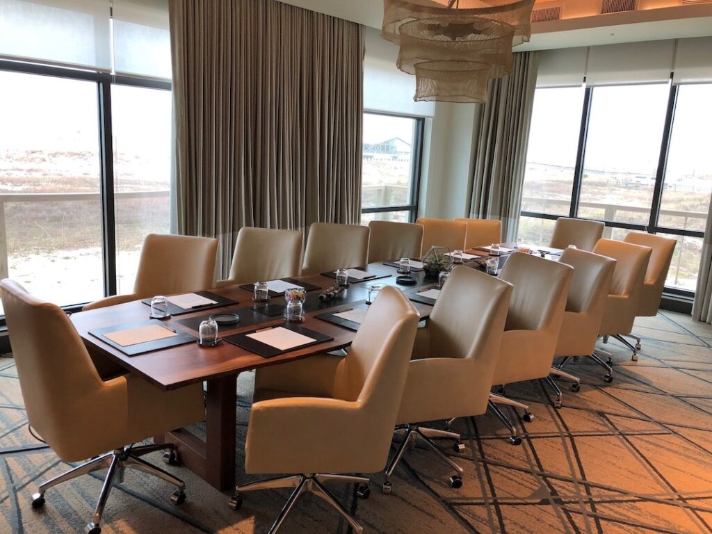 Chairs arranged around a table in a boardroom