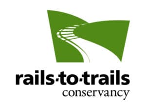 Rails to Trails Conservancy Logo, showing rail ties winding between green hills and transitioning to become a path