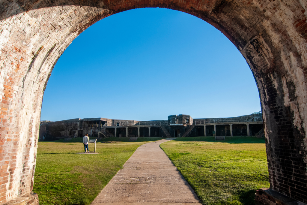 An archway looking into fort Morgan 