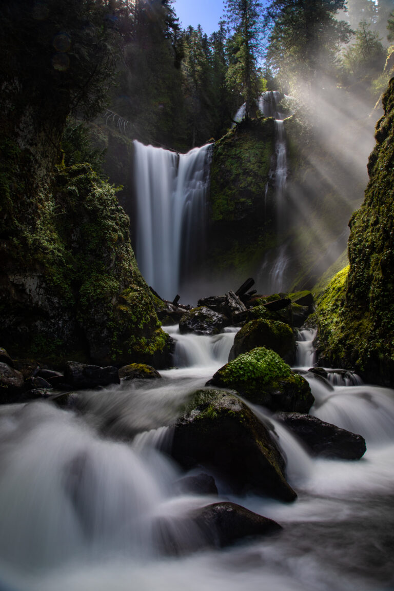 Long exposure photo of waterfall cascading down rocks