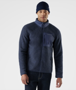 Man in a. beanie hat looking at the camera wearing a Smartwool - Men’s Second Cut™ Fleece Jacket