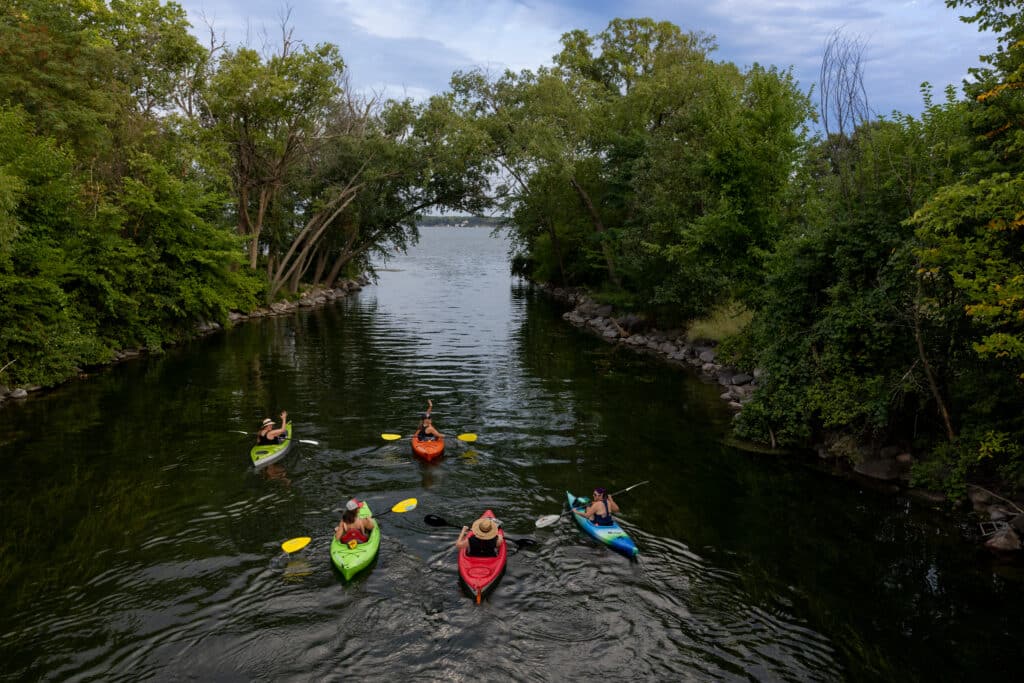 Kayakers move through water in Madison, Wisconsin.